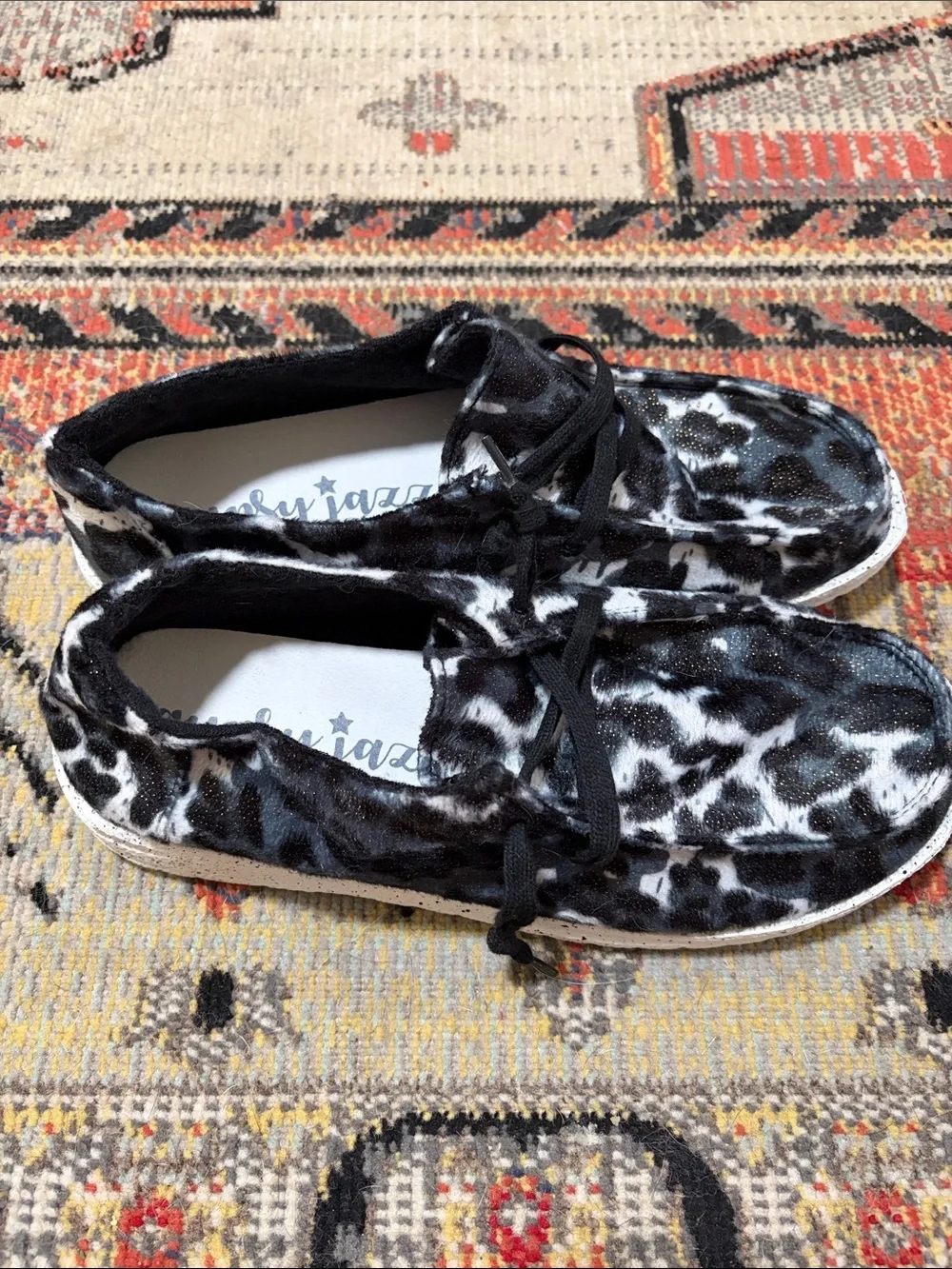 Gypsy Jazz Black & White Cow Print Slip-On Sneakers